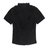 Chemisier gothique victorien noir en dentelle à taille cintrée